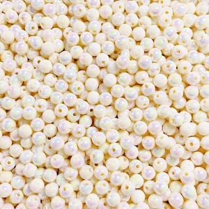 Detailed macro view of 8-12mm creamy round luminous beads with pearlescent finish