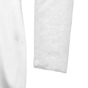 Close-up of white slim dress featuring elegant floral lace sleeves and smooth fabric texture