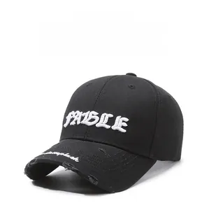 Detailed view of white FABLE 3D embroidery and distressed ripped brim on black cotton cap