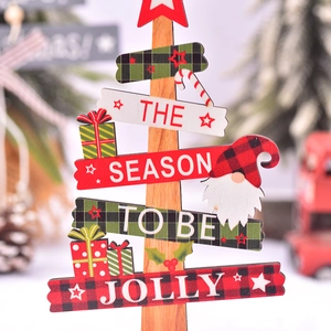 Classic wooden Christmas tree tabletop decoration with festive Santa and gift patterns
