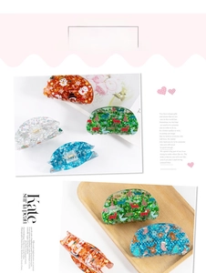 Detail of Christmas claw clips with reindeer, tree and snowflake glitter patterns