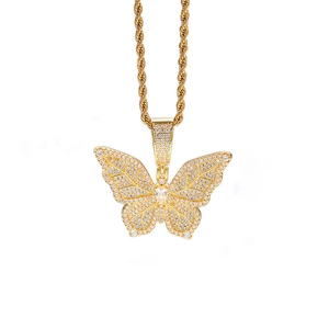 Detail of gold butterfly pendant with sparkling cubic zirconia on a rope chain