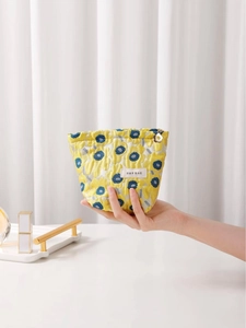 Handheld yellow floral jacquard makeup bag with high capacity and metal zipper closure