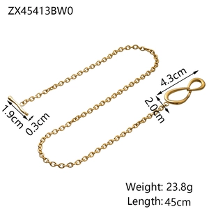 Detail of gold snake chain necklace showing infinity clasp and toggle closure dimensions