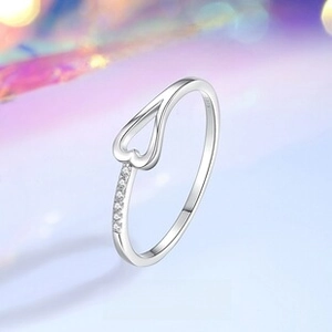 Macro shot of S925 sterling silver heart ring band with inlaid zircons and S925 stamp