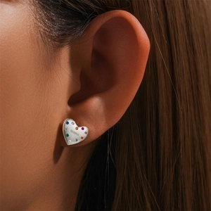 Close-up of 925 sterling silver heart earrings with colorful stones and Mama engraving