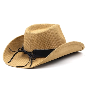 Classic straw western cowboy hat with black leather band and curved brim on white background