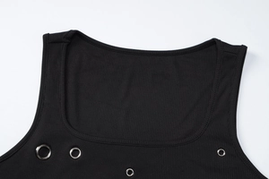 Detailed close-up of square neckline on black ribbed tank top with silver metal eyelets