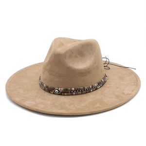 Classic khaki suede fedora hat with brown woven leather band and evil eye charm