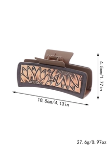 Brown western cowboy faux leather hair claw clip featuring embossed sunflower design