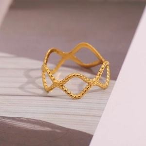 Macro shot of 18K gold plated stainless steel ring with woven wave texture detail