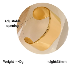 Polished gold wide cuff bracelet with 36mm height and adjustable opening detail