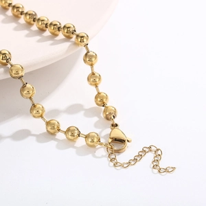 Minimalist golden stainless steel bead necklace set featuring high-polish finish and lobster clasp