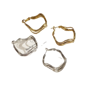 Minimalist irregular twisted geometric hoop earrings in gold and silver finish