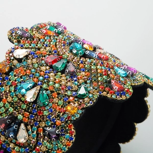 Colorful rhinestone flower headband featuring vibrant teardrop crystals and vintage wavy design