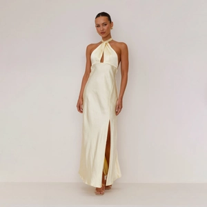 Detailed view of champagne satin dress with halter neck and side slit design