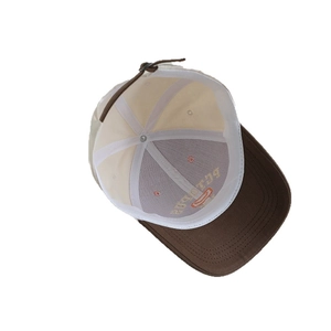 Inside view of a two-tone kids baseball cap with brown brim and adjustable metal buckle