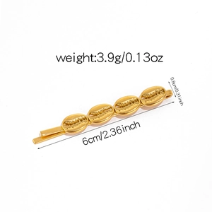 Detailed view of a gold shell-shaped hair clip with precise size and weight measurements