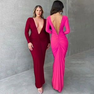 Detail of elegant V-neck slimming dress with ruched waist and sexy open back design