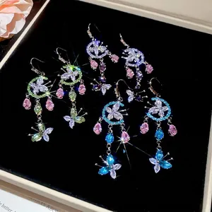 Elegant floral butterfly drop earrings with colorful zircon crystals on black velvet base