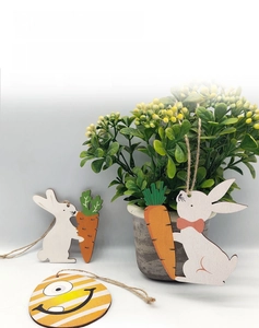 Detail of Easter wooden egg and bunny hanging ornaments with jute twine for decor