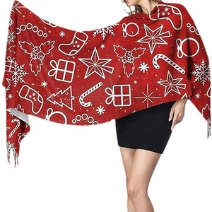Elegant red Christmas cashmere-feel scarf with white festive patterns and fringe detail