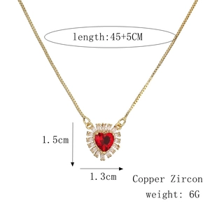 Detail showing heart pendant size 1.5x1.3cm and 45+5cm gold chain with red zircon