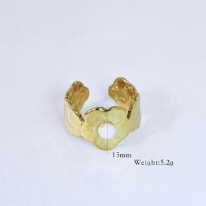 Detailed macro view of a 15mm 14k gold plated flower ring with a white center pearl