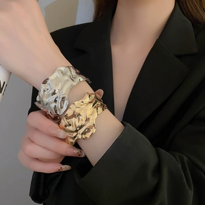 Minimalist metallic open bangle with irregular crinkle texture in gold and silver finish
