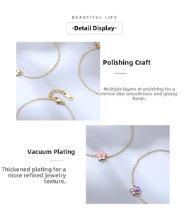 Detailed view of gold flower bracelet with pink and purple gems and lobster clasp