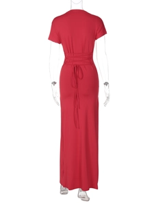 Detailed back view of a slim fit red summer dress with crisscross tie waist detail