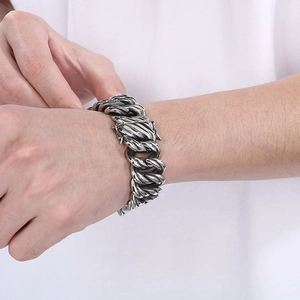 Men's retro stainless steel Cuban chain bracelet with vintage dragon clasp on wrist