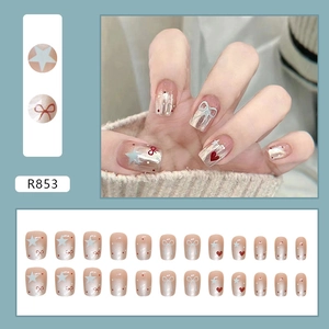24pcs short press-on nails set featuring nude base with stars, bows, and heart designs