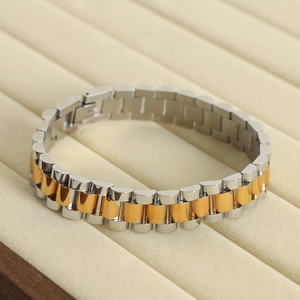 Polished two-tone gold and silver chain bracelet in classic jubilee style for women