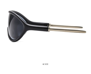 Detail side view of sport sunglasses featuring a black frame and champagne gold metal temple