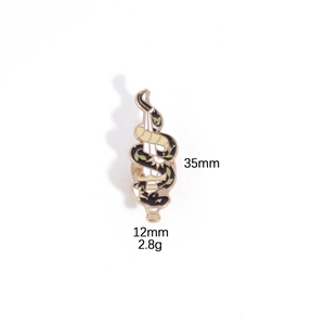 Detail of gothic enamel pin showing black snake wrapped around a gold dagger with dimensions