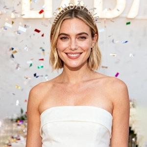 Close-up of sparkling Birthday Girl rhinestone headband worn in festive party setting