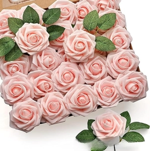 Detail of light pink PE foam roses with green leaves in a kraft paper gift box