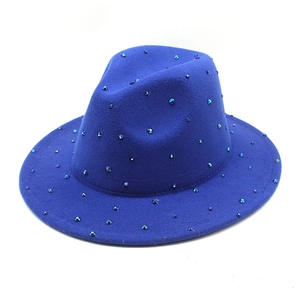Detailed close-up of dark blue wool fedora hat with sparkling colorful rhinestones