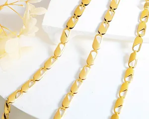Detailed close-up of 18k gold plated stainless steel necklace with matte geometric links