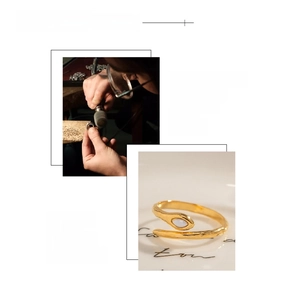 Detail of 18K gold snake ring showing marquise natural stone and polished finish