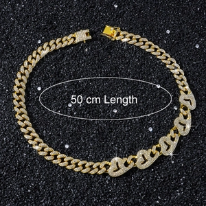 Detailed view of a 50 cm gold hip-hop Cuban link chain necklace with iced-out heart links