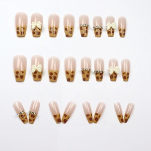 Faux ongles longs trapèze avec motifs léopard, nœuds 3D et strass brillants