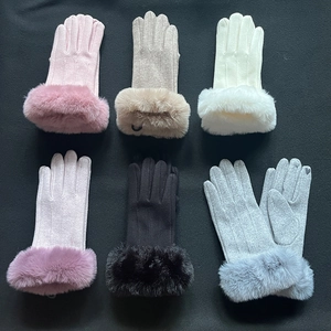 Flat lay of women's thermal knit gloves in six colors with faux fur trim