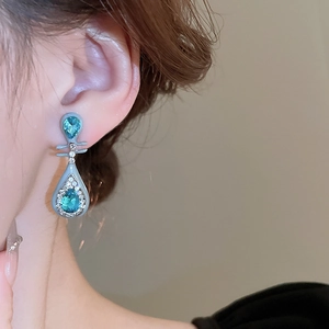 Close-up of teardrop sea-blue zircon earrings with silver alloy in vintage Chinese style