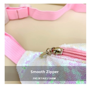 Detail view of the smooth metal zipper and pink nylon strap on mermaid sequin bag