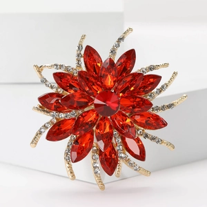 Elegant vintage flower brooch with red marquise crystals and pavé diamonds in gold plating