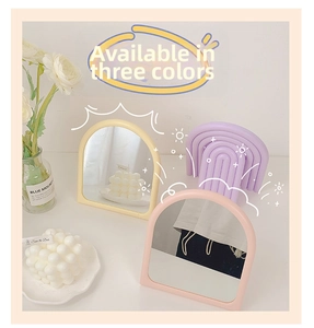 Three Macaron colored arched desktop mirrors with minimalist frames and aesthetic decor