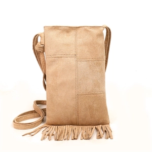 Brown suede tote bag with fringe details and long shoulder strap on white background