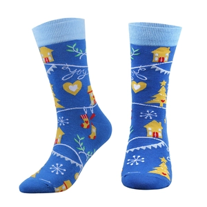 Cozy blue Christmas crew socks featuring festive trees and winter house patterns